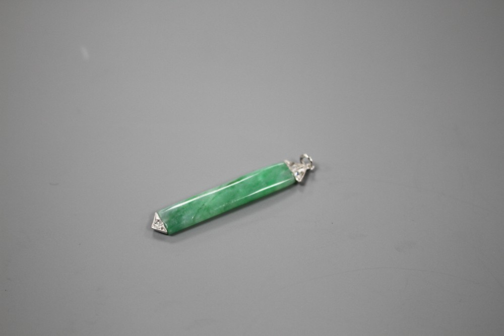 A 1920s style white metal mounted, jade and diamond pendant, overall 38mm, gross weight 1.7 grams.